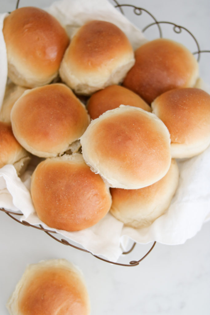 homemade rolls in a wire basket