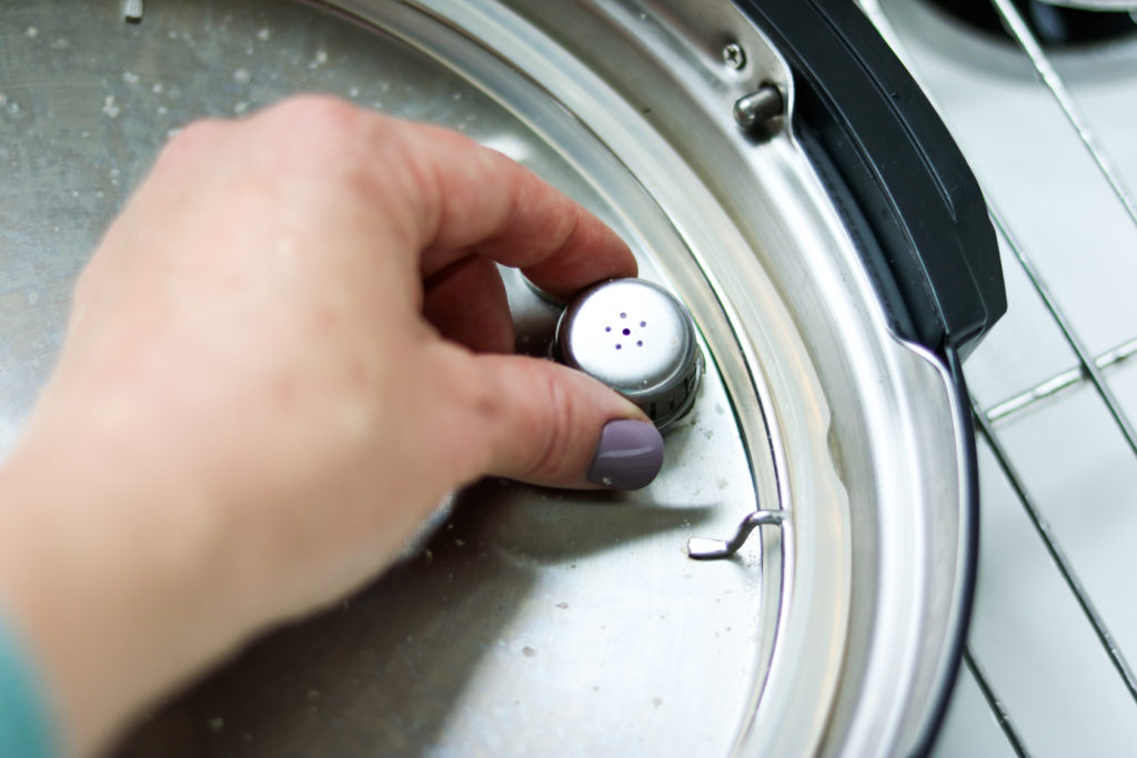 hand removing instant pot anti-block shield