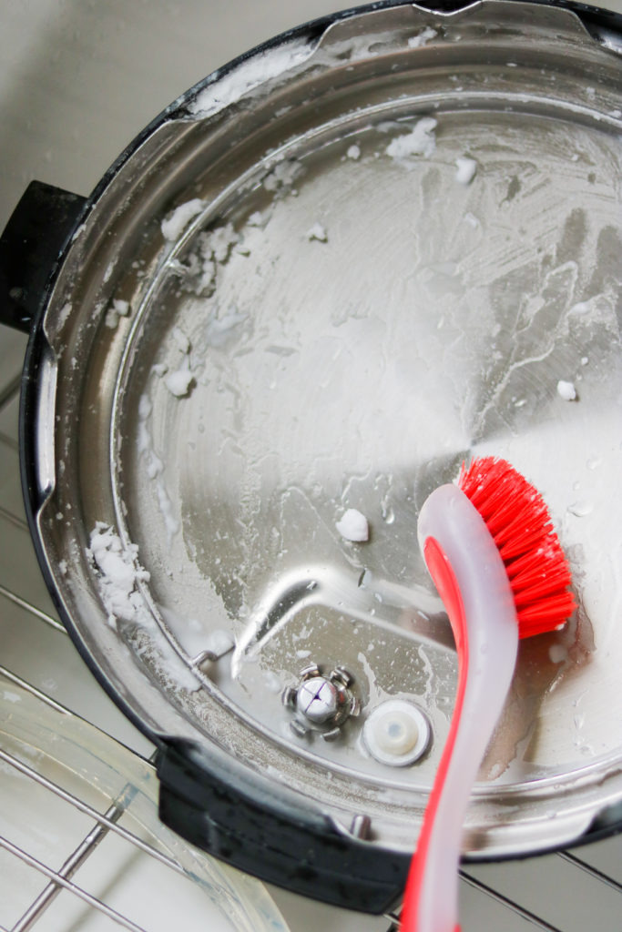 dish brush and baking soda paste to clean instant pot lid