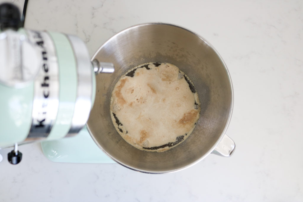 yeast bubbling in an electric stand mixer bowl