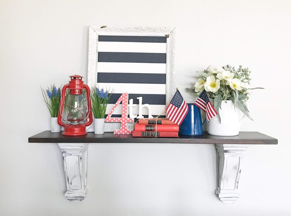 4th of July decor on shelf.