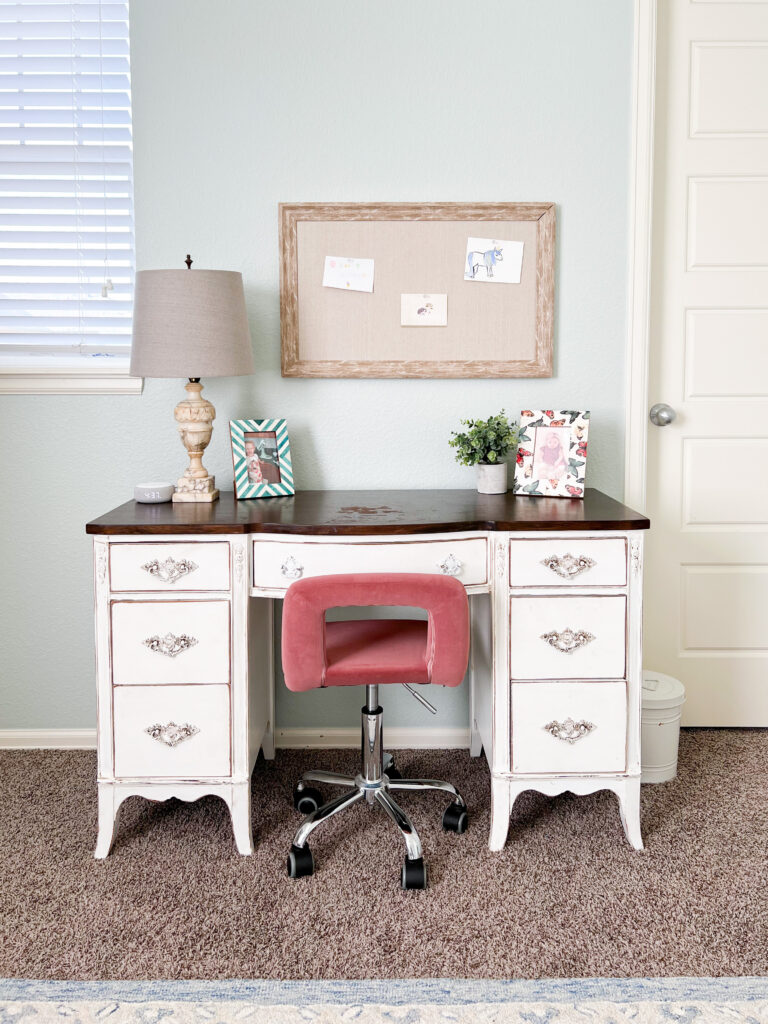 white desk with pink chair in bedroom