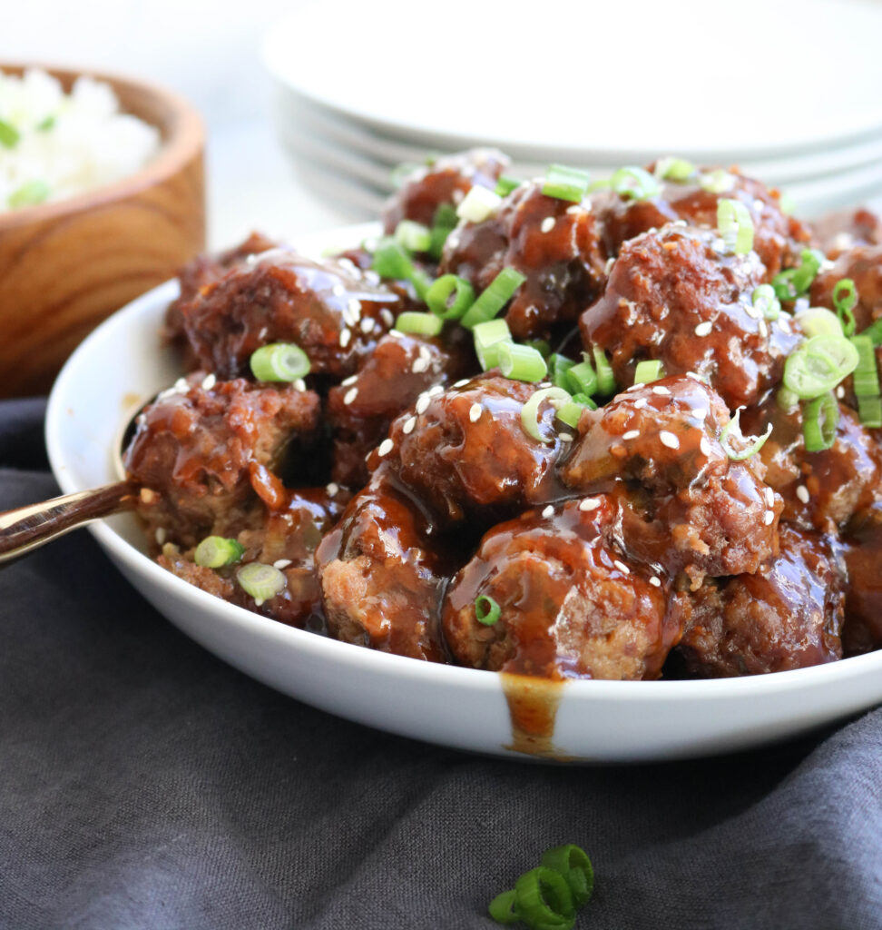Instant Pot Freezer Meals Asian Meatballs on a white bowl with chives on top
