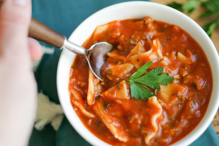 Gluten Free Instant Pot Lasagna Soup in a white bowl with spoon